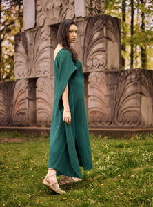 Model wearing a Diana cotton gauze cape caftan in pine green.