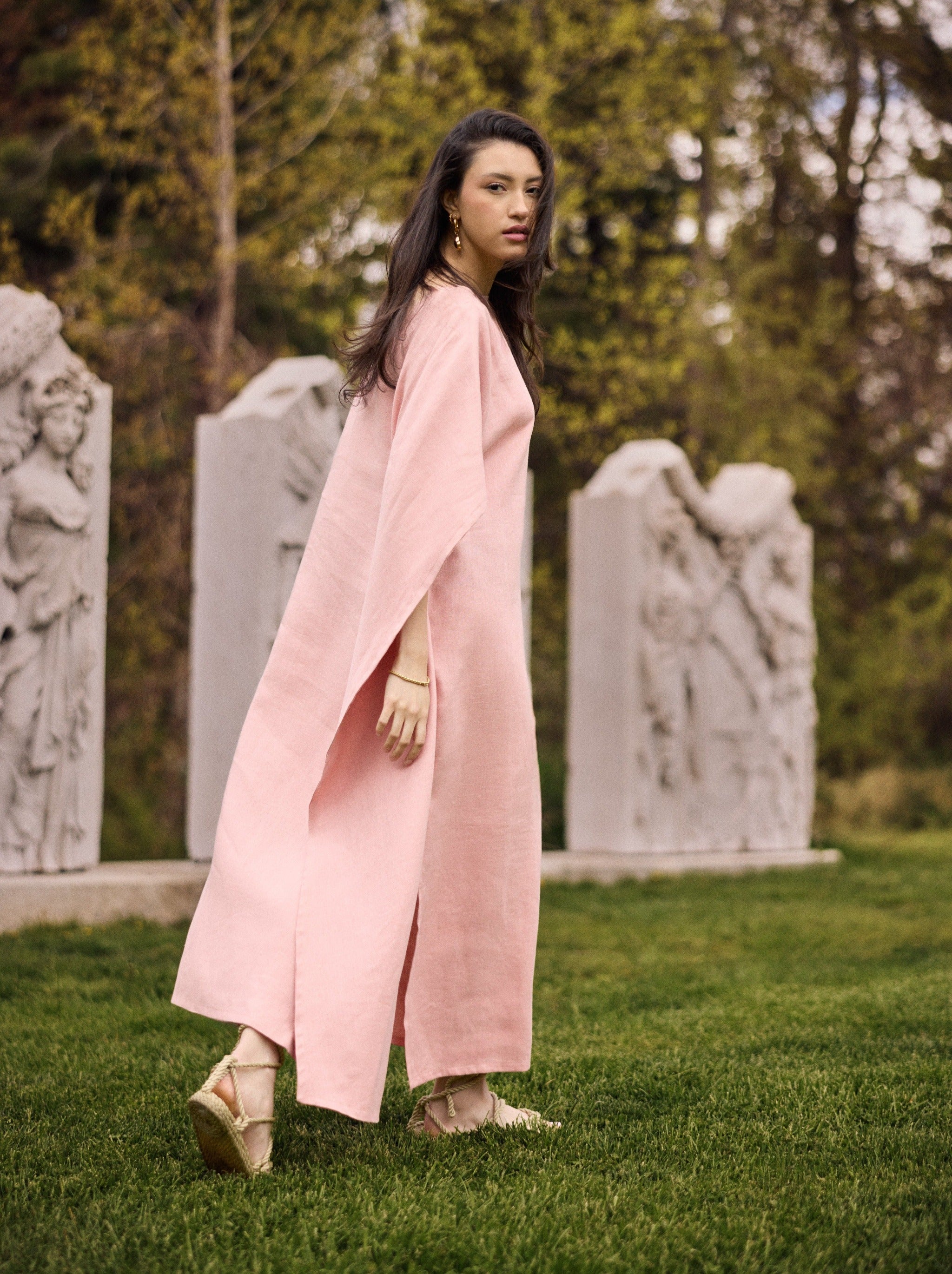 Model wearing a Diana linen cape caftan in pink rose.